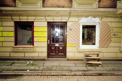 local les materiales seen from outside, small stairs lead up to the window on firstfloor which is the entrance